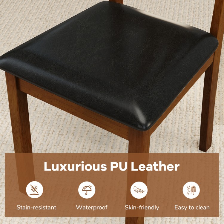 Close-up of a wooden dining chair with luxurious PU leather seat, featuring a brown rubber wood frame for easy cleaning.