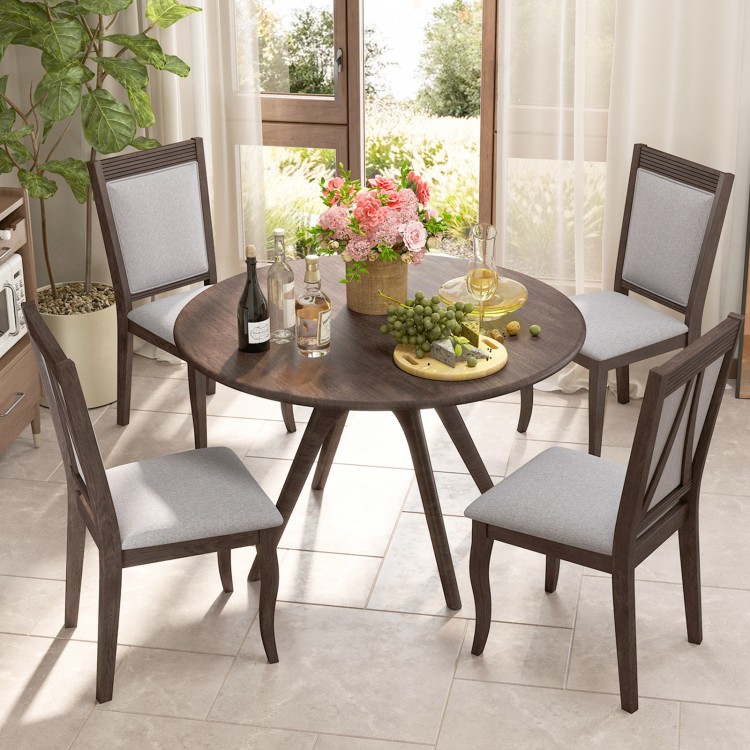 Round dining table set with two brown rubber wood chairs featuring padded seats, perfect for stylish dining spaces.