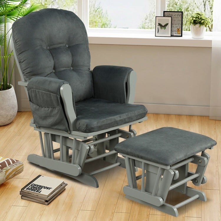 Dark gray glider chair with padded armrests and detachable cushion, featuring a stable base for safety and comfort.