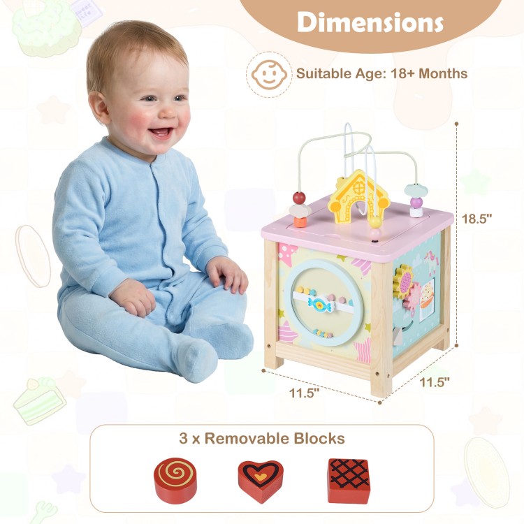Wooden activity cube for toddlers with removable blocks, pretend kitchen, and hidden storage, promoting sensory play.