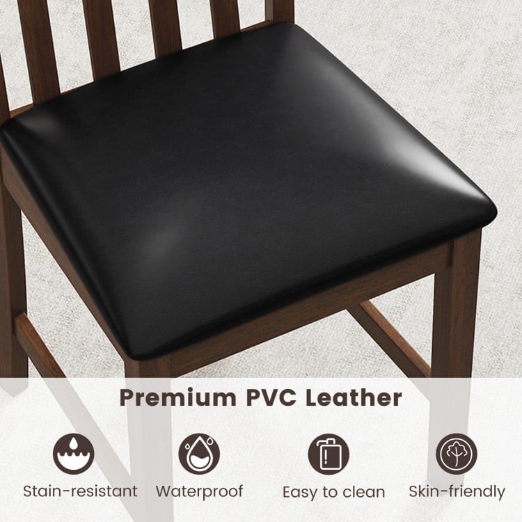 Close-up of the padded seat of a wooden dining chair set, featuring skin-friendly PVC leather for easy cleaning and.