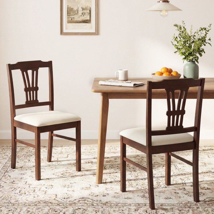 Set of 2 wooden dining chairs with upholstered beige seats and solid rubber wood frames, ideal for kitchens and dining.