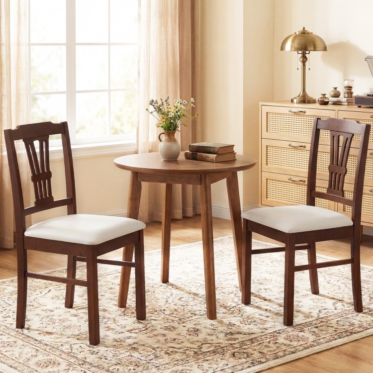Set of 2 upholstered wooden dining chairs with solid rubber wood frame and beige fabric, ideal for kitchen or dining.