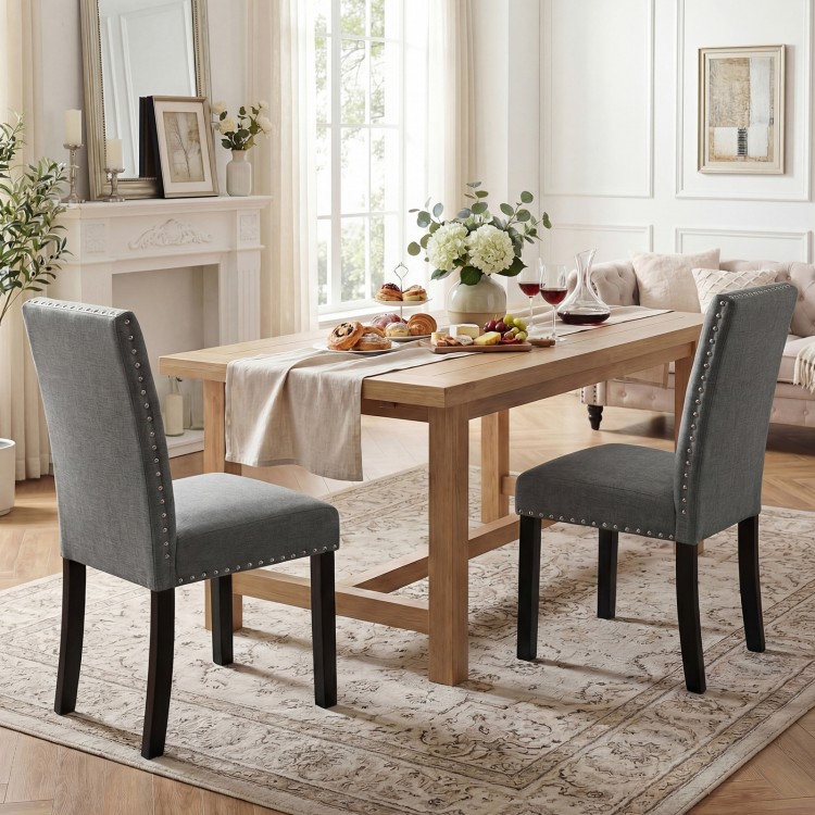 Set of 2 wooden dining chairs with soft cushions and bent wood legs, perfect for home or cafe dining.