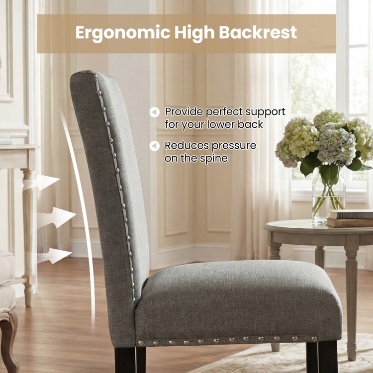 Side view of a wooden dining chair with ergonomic high backrest and nailhead trim, designed for comfort and style.