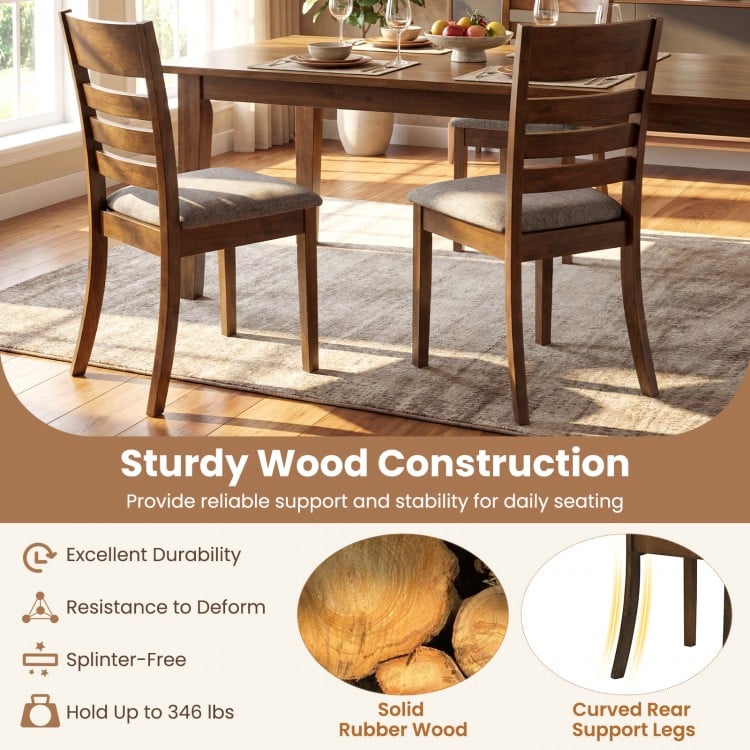 Wooden dining chair from a set of 4, featuring a rubber wood frame and upholstered seat for comfortable seating.