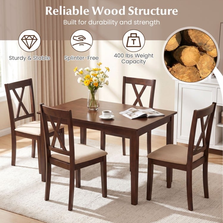 Walnut wooden dining table with four upholstered chairs, featuring ergonomic backrests and a sturdy design for dining.