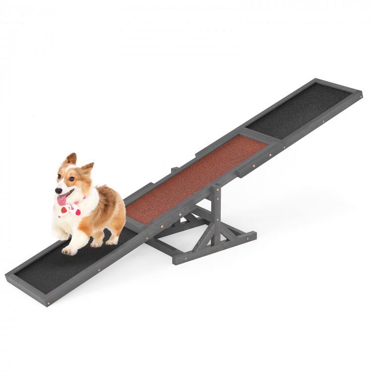 Wooden dog agility seesaw in gray with high traction surface, designed for outdoor obstacle courses and training.