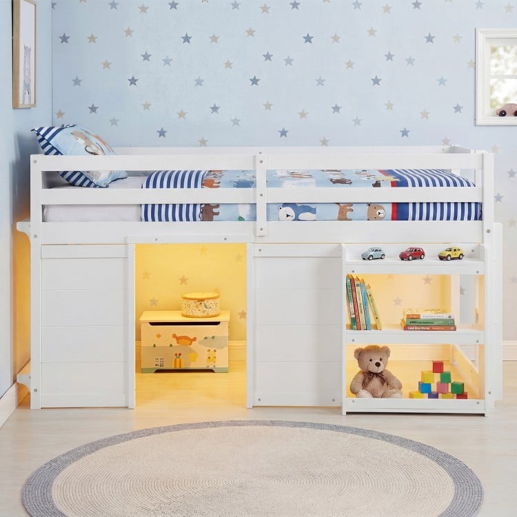Wooden low kids loft bed in white with LED lights, under-bed storage, and safety guard rail for playful bedroom design.