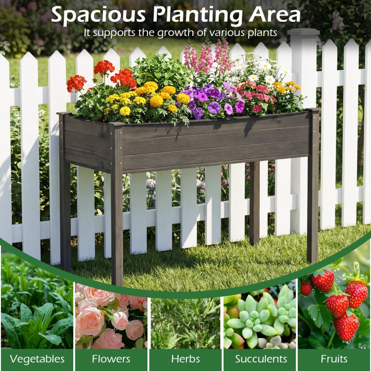 Wooden raised vegetable garden bed in gray, 4 ft long, ideal for growing various plants in gardens or patios.