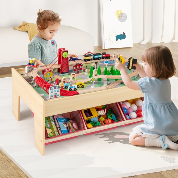 Wooden train set table with reversible tabletops, featuring 94 accessories for imaginative play, ideal for kids over 3.