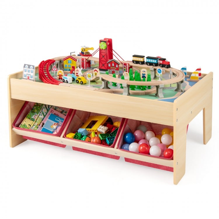 Wooden train set table with reversible tabletops, 94 accessories, and 3 storage drawers for kids' playtime fun.