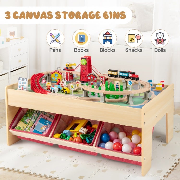 Wooden train set table with reversible tabletops and 3 fabric storage bins for organized playtime fun.