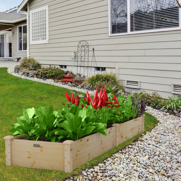 Wooden vegetable raised garden bed made of solid fir wood, ideal for planting in backyard or patio settings.