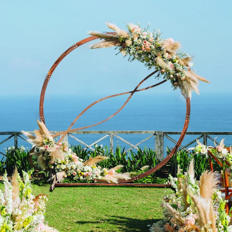 Wooden wedding arch in round shape, crafted from natural fir wood, ideal for outdoor ceremonies and floral decorations.
