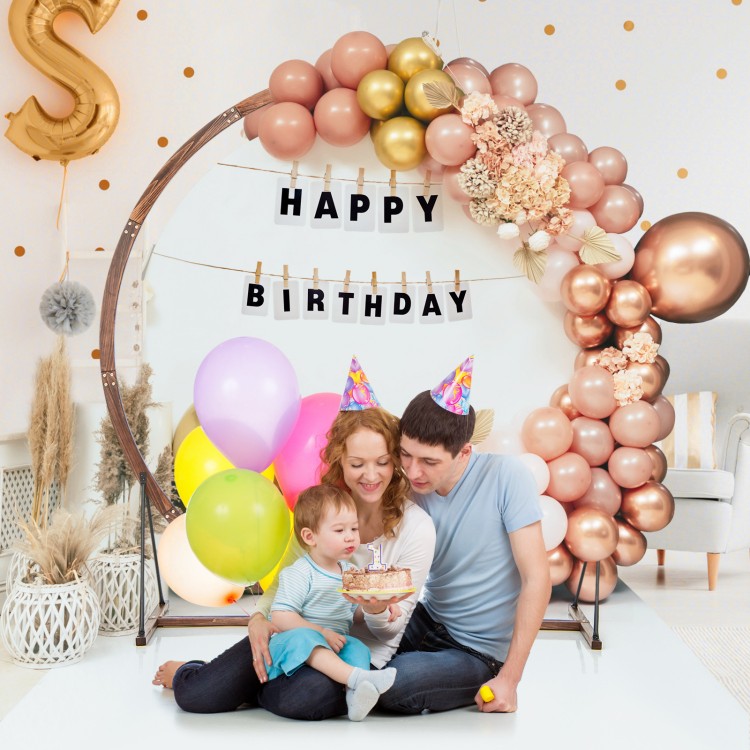 Wooden wedding arch backdrop with balloons and decorations, perfect for birthday celebrations and events.
