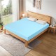 3-inch gel-infused cooling mattress topper in blue on a wooden bed, designed for comfort and pressure relief.