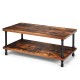 Industrial vintage coffee table with a rustic brown top and black steel legs, featuring a double-tier storage shelf.