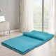 Adjustable blue foldable floor sofa in a cozy setting, featuring a soft suede surface and six reclining positions.