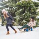 Folding snowsled with pulling ropes and metal rails, designed for stable sliding on snow, ideal for outdoor fun.