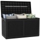 Black 100-gallon resin deck box with rattan texture, filled with cushions, ideal for outdoor waterproof storage.