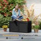 Black 100-gallon resin deck box with rattan texture, serving as a bench or table, supports up to 440 lbs for outdoor.