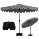 10-foot gray patio umbrella with ruffled edges, weighted base, and sandbags for stability, ideal for outdoor gatherings.