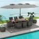 Elegant patio dining set arranged poolside, showcasing gray wicker chairs with soft cushions and large double-sided.