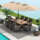 10-piece patio wicker dining set featuring a brown acacia wood tabletop and a large double-sided umbrella for outdoor.