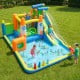Inflatable bounce house with water slide features a climbing wall, splash pool, and basketball hoop for outdoor fun.