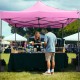 Pink 10 x 10 FT outdoor pop-up canopy tent with sturdy structure, ideal for markets, parties, and events.