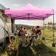 Pink 10 x 10 FT outdoor pop-up canopy tent with sturdy metal frame, ideal for picnics and outdoor gatherings.