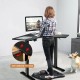 L-shaped electric standing desk in black with LCD display, anti-collision function, and adjustable height for ergonomic.