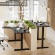 L-shaped electric standing desk in black with LCD display, featuring height adjustment and spacious work surface for.