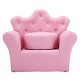 Children's pink upholstered princess sofa with a round ottoman, featuring diamond accents, perfect for leisure and.