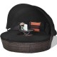 Round outdoor daybed with retractable canopy, black cushions, and adjustable table, perfect for patio or poolside.