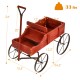 Wooden wagon plant bed in red with metal wheels, featuring two planting sections for garden use and easy mobility.