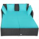 Spacious outdoor rattan daybed in turquoise with upholstered cushions and pillows, perfect for relaxation and comfort.