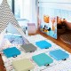 Colorful 15-inch square toddler floor cushions with handles, featuring waterproof covers and soft foam for comfortable.