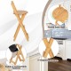 Bamboo folding barstool with round seat edge, ergonomic backrest, and X-shaped structure for home or cafe use.