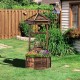 Rustic wooden wishing well planter with adjustable bucket, made of carbonized fir wood, ideal for garden or patio use.