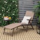 Foldable chaise lounge chair in brown with adjustable footrest, perfect for poolside relaxation or outdoor use.