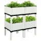Elevated white planter box set with four planting sections, designed for growing vegetables and herbs in outdoor spaces.
