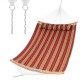 Red outdoor hammock with detachable pillow, made of breathable polyester, perfect for backyard relaxation or camping.