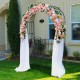 Steel garden arch with a 2-seat bench, featuring a floral arrangement, perfect for outdoor relaxation and decoration.