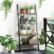 4-tier industrial leaning wall bookcase in brown with metal frame, ideal for organizing plants and books in a rustic.