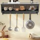 Wall-mounted black cubby organizer shelf with four hooks for entryway storage and display of kitchen utensils.