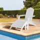 White Adirondack folding ottoman made of all-weather HDPE, perfect for relaxing by the pool or patio.