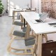 Ergonomic gray kneeling chair with curved base, designed for upright posture and comfort in office settings.