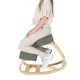 Ergonomic gray kneeling chair with curved base, promoting upright posture and comfort for home or office use.